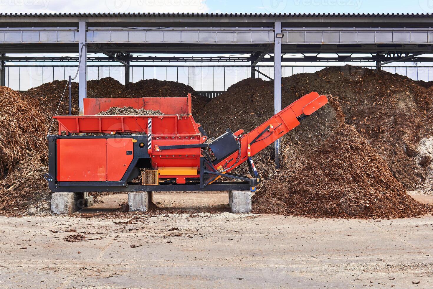 industrial woodchipper producing wood chips photo