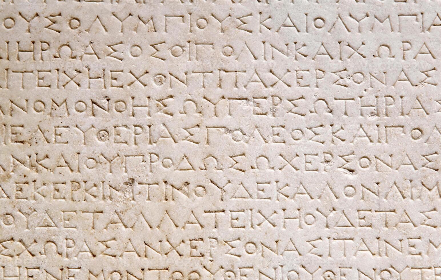 fragment of a marble slab from Chersonesos, Crimea, with cut out city-state citizen oath text photo