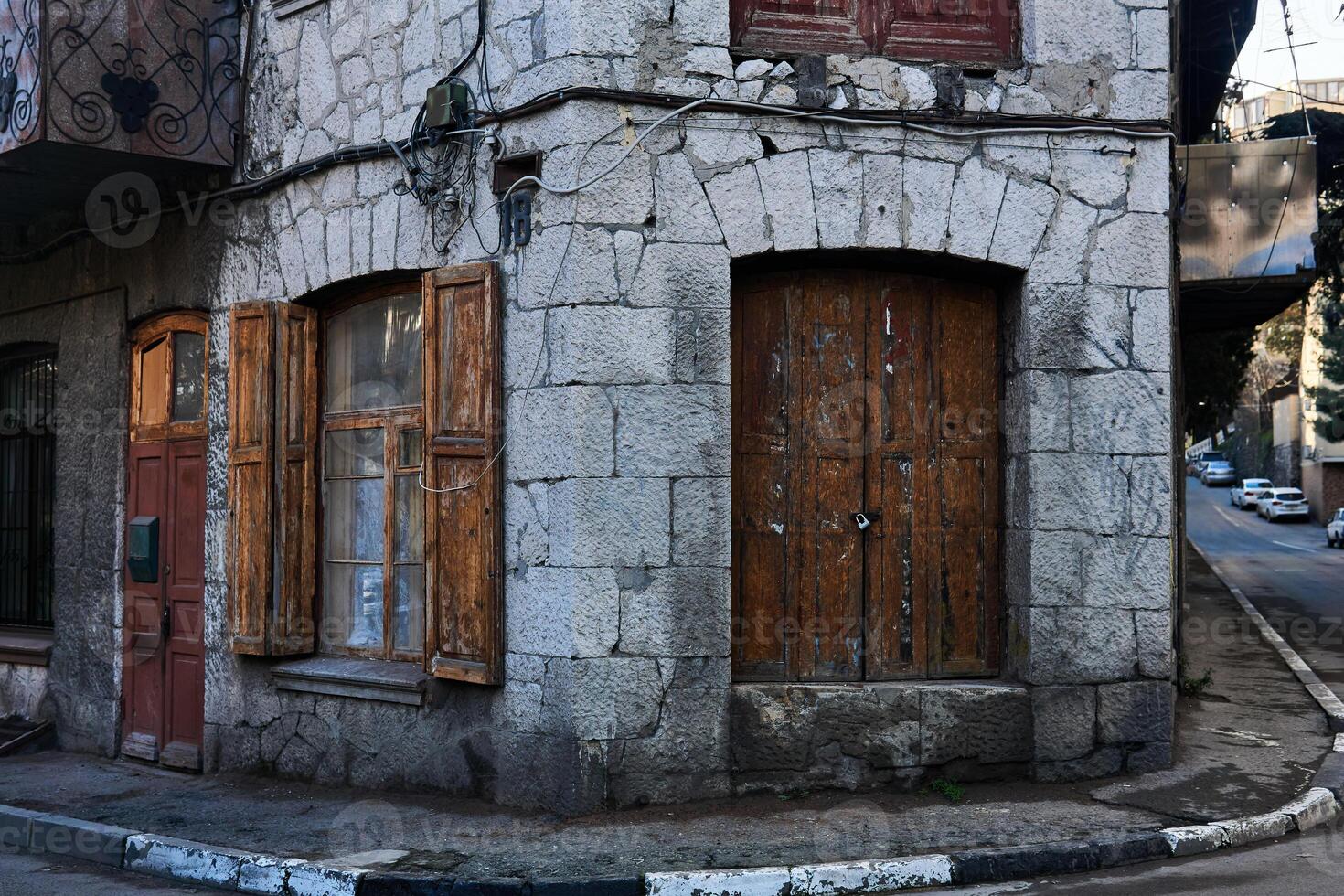 fragment of a vintage town house on a street corner photo