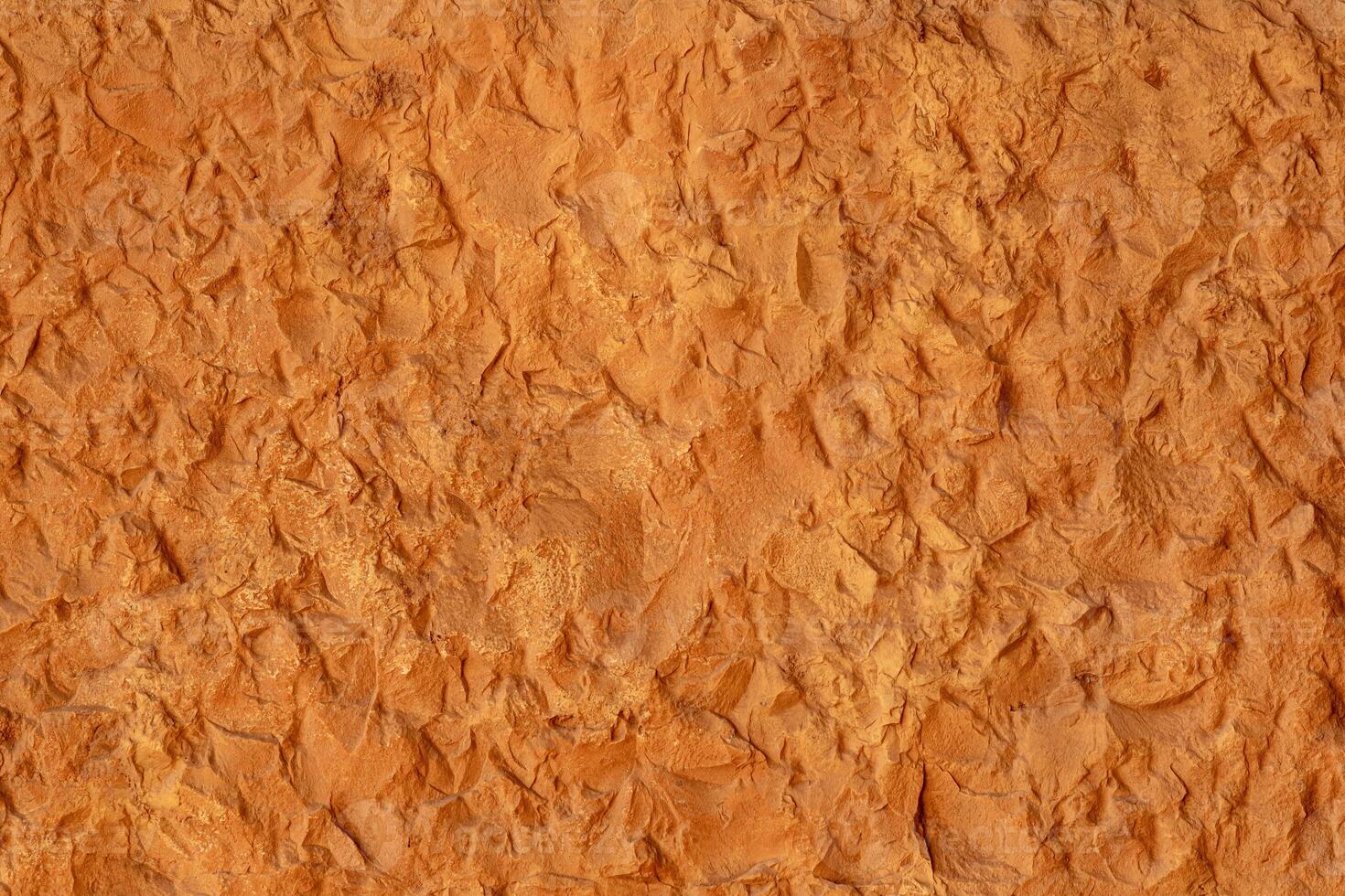 texture of a natural rough-cut stone of an ancient building photo