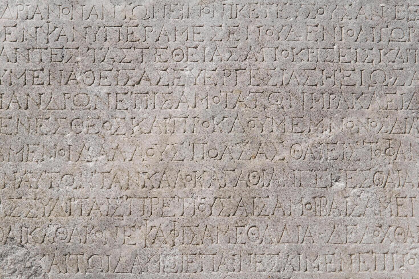 fragment of a marble slab from Chersonesos, Crimea, with a carved inscriptions in ancient Greek about the embassy in Rome photo