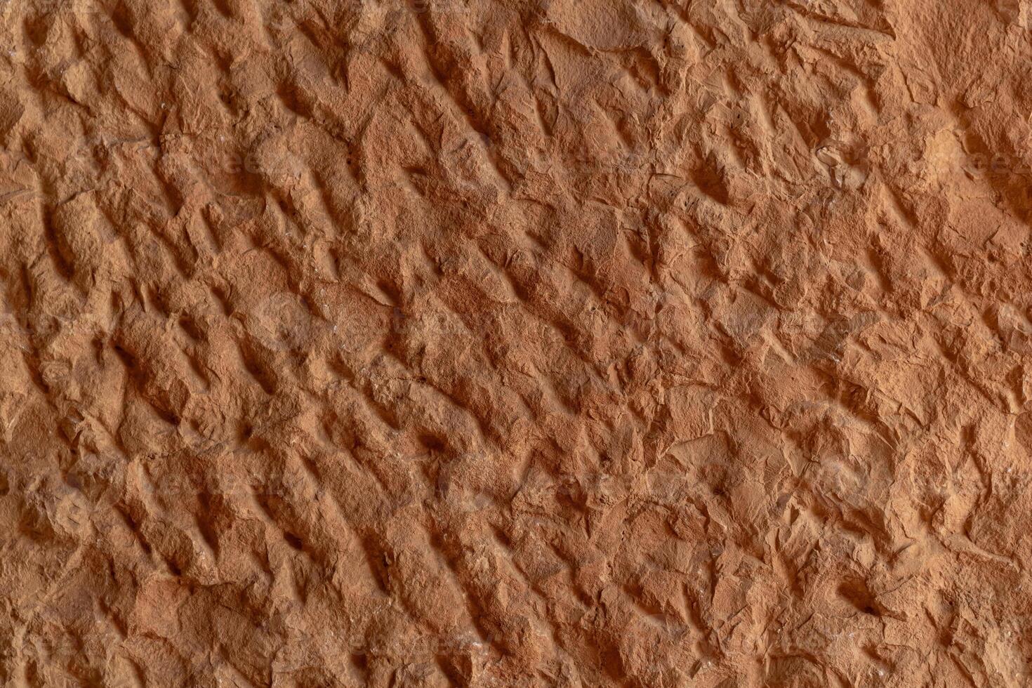 texture of a natural rough-cut stone of an ancient building photo