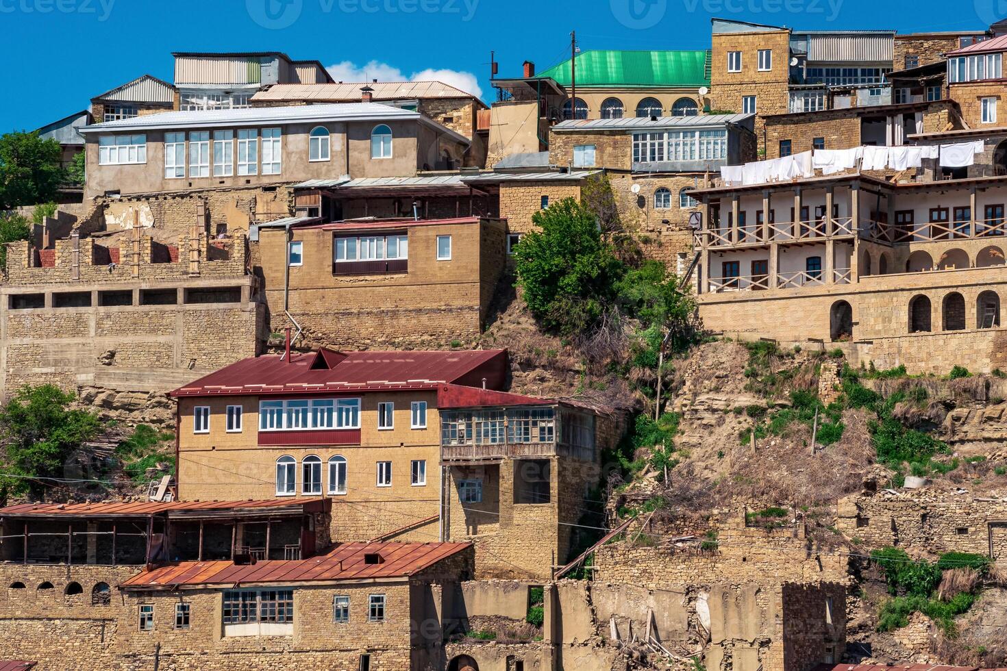 houses on a rocky slope in the mountain village of Chokh in Dagestan photo