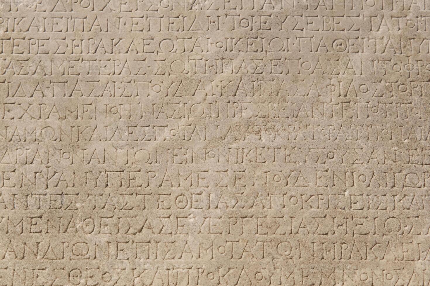 fragment of a marble slab from Chersonesos, Crimea, with a carved inscriptions in ancient Greek about the embassy in Rome photo