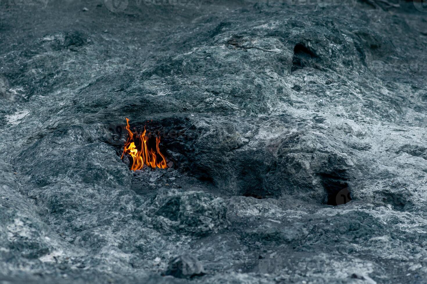 constantly burning fire at the place of a natural gas emission on Mount Chimaera Yanartas, Turkey photo