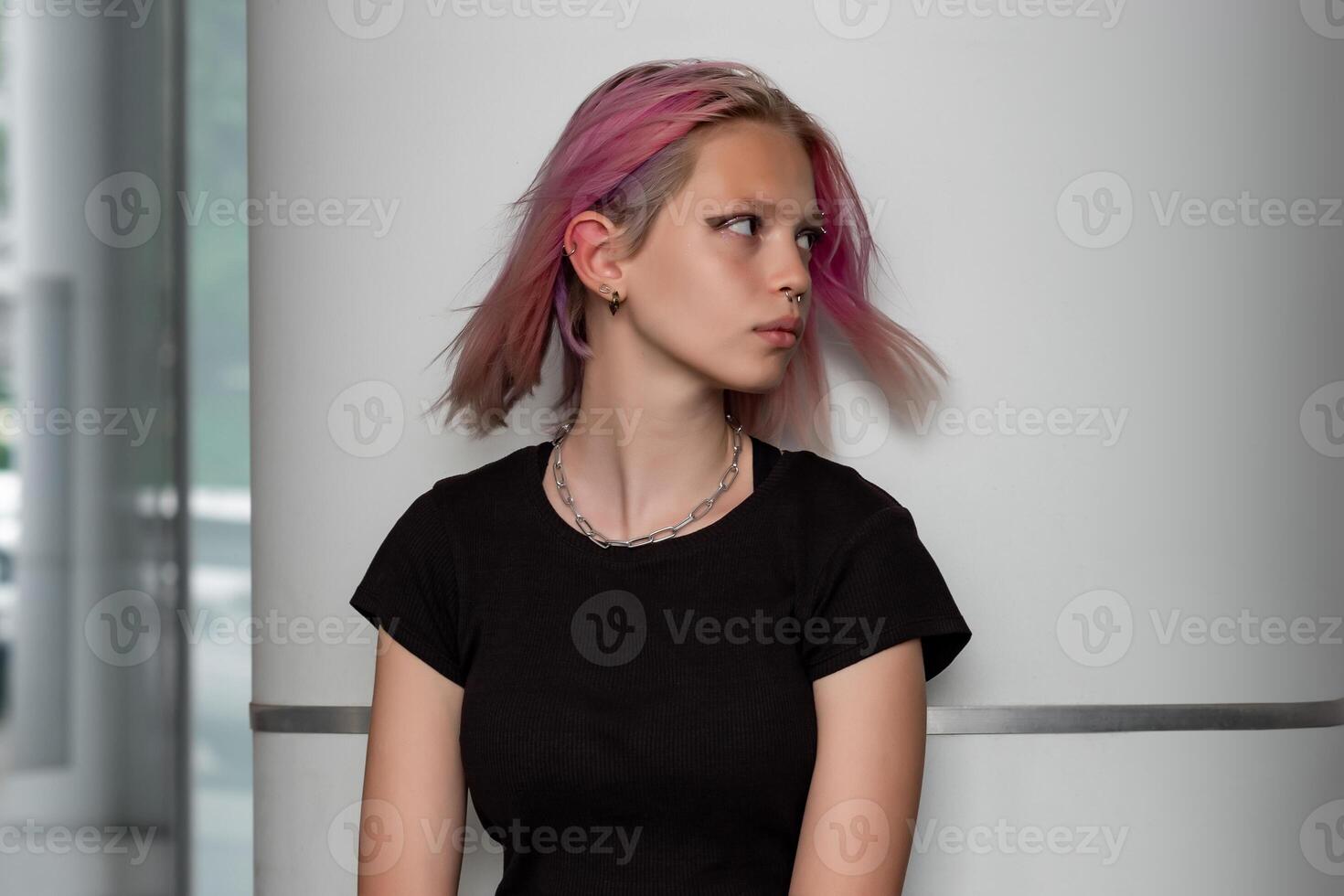 portrait of a teenage girl on an urban background photo