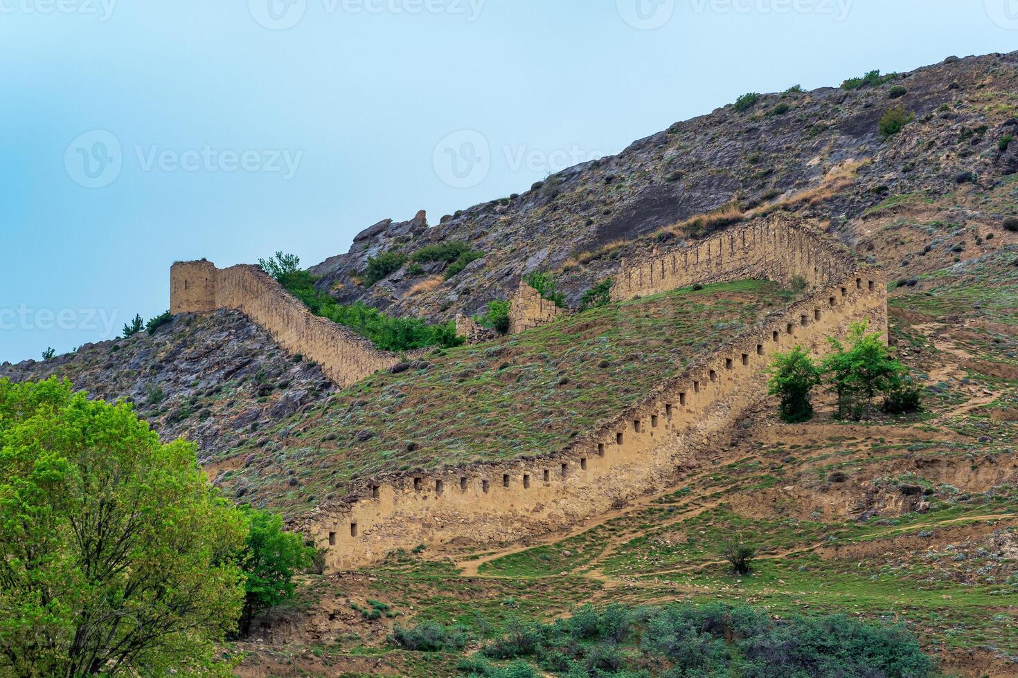 medieval fortress wall on a mountain slope, Shamil Gunib fortress in Dagestan photo