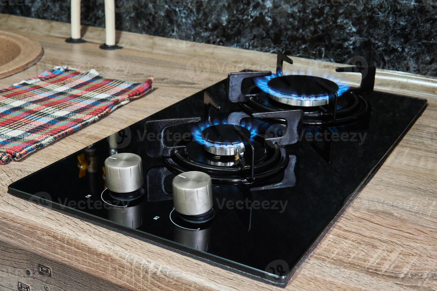 household cooktop with gas burners on photo