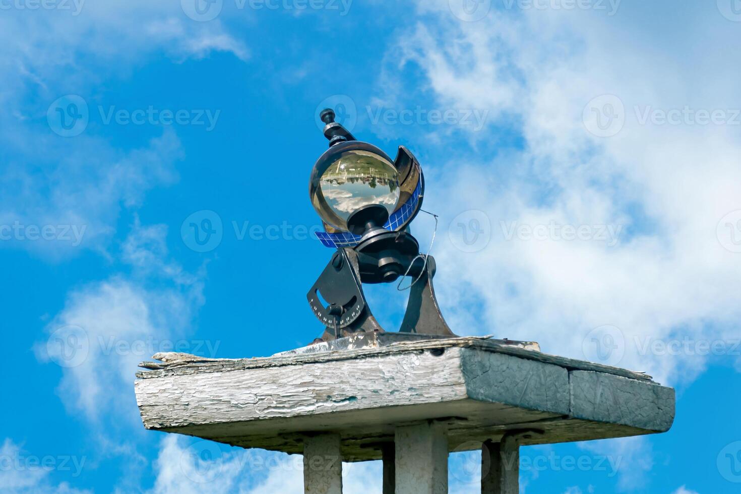 spherical meteorological sunshine recorder heliograph at the weather station against the sky photo