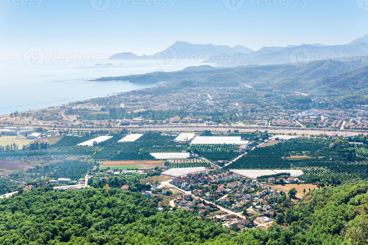 top view of Mediterranean coastal resort village with gardens and hotels in Camyuva, Turkey photo