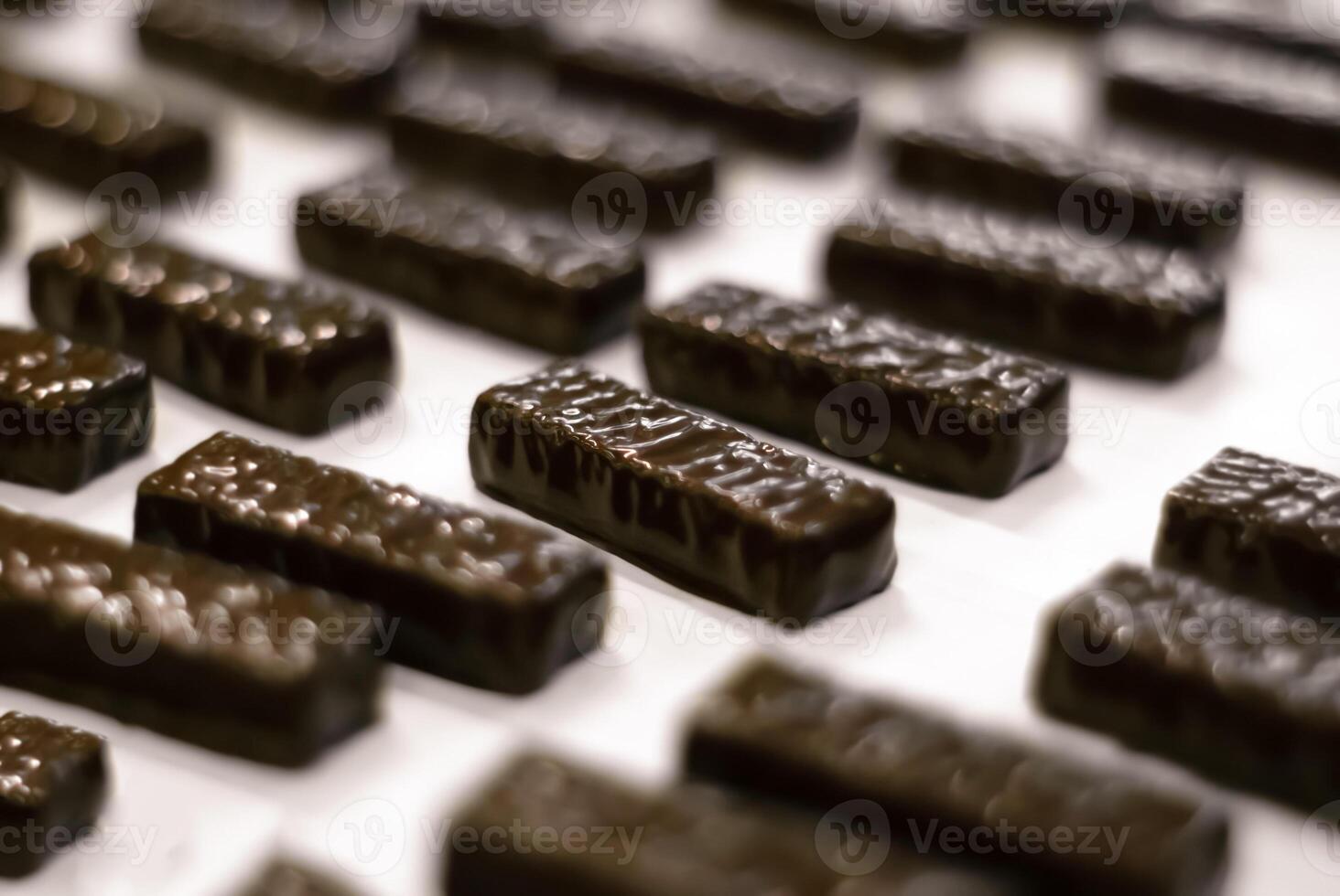 molten chocolate poured into a tray in a confectionery factory, close-up photo