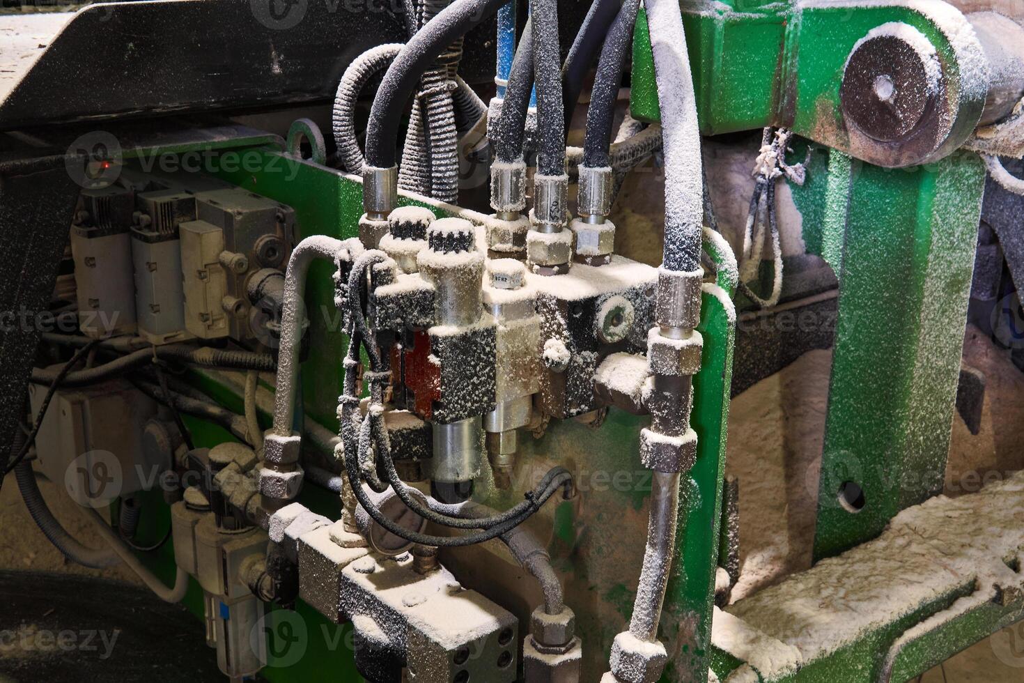 machinery and electrical equipment of the sawmill, covered with a layer of sawdust photo