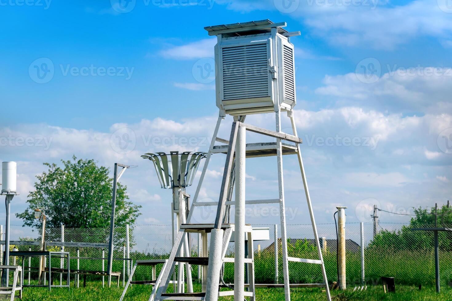 measurement site at a weather station with various meteorological instruments photo