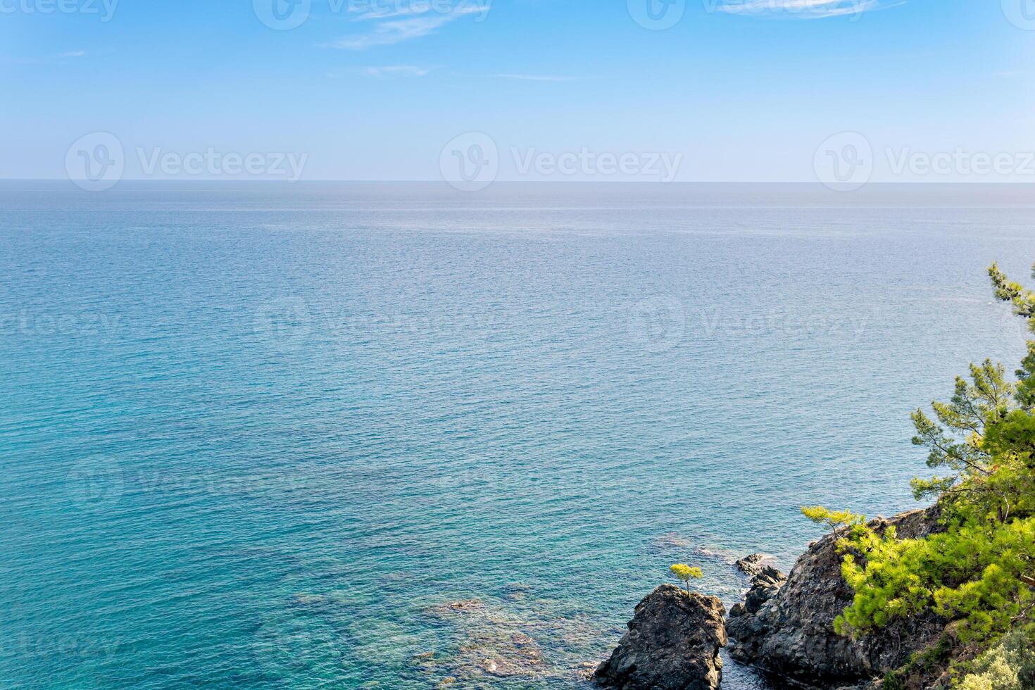 Mediterranean seascape with steep wooded coast photo