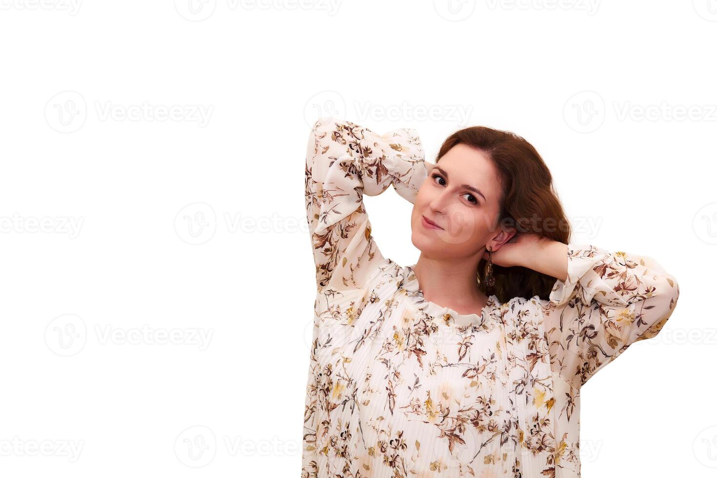 smiling beautiful young woman in a light dress dreamily, isolated on white background photo