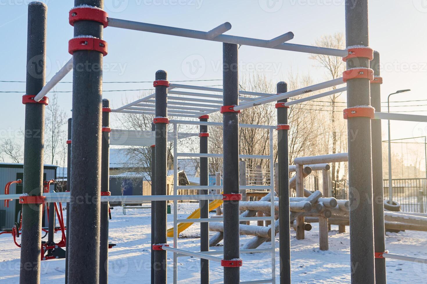 outdoor public sports playground on a frosty winter day photo