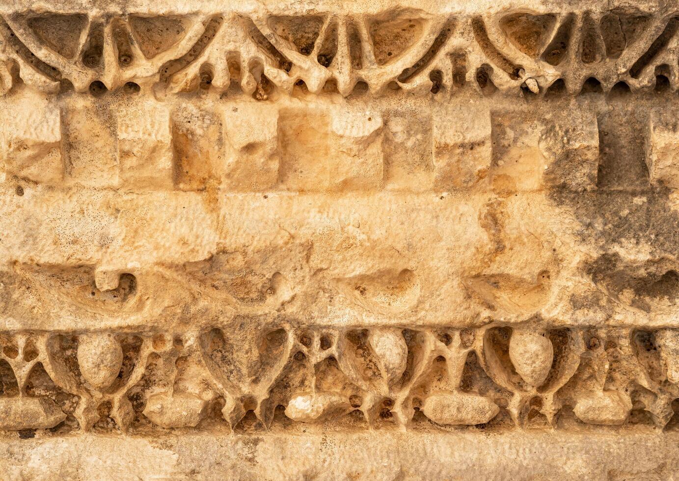 ancient weathered ornament on the ruins of a building in the ancient city of Mira, Turkey photo