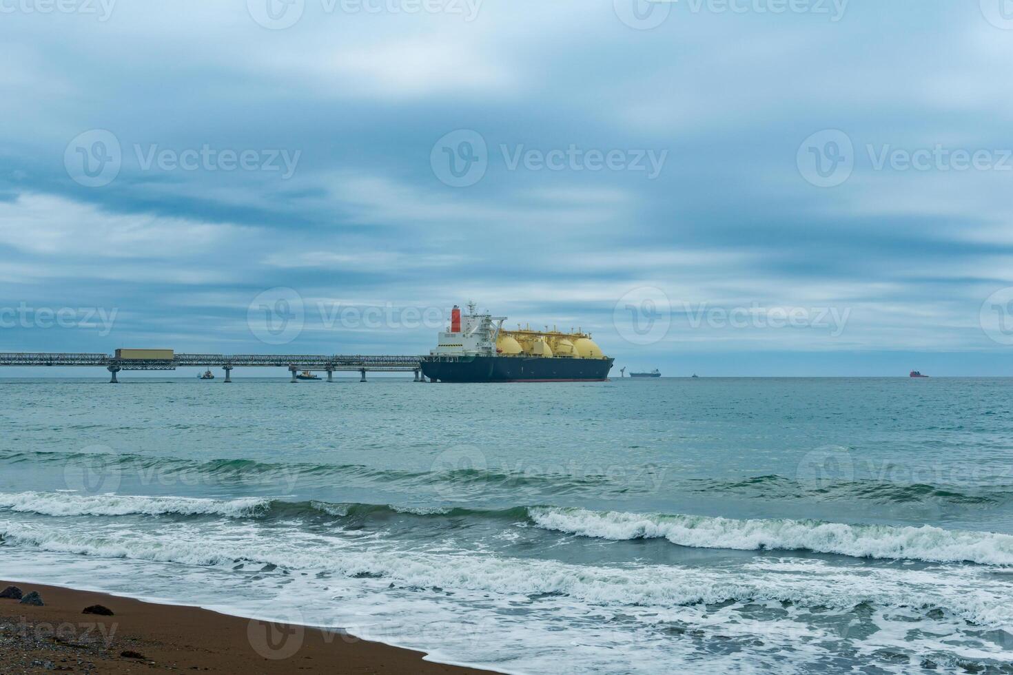 liquefied natural gas carrier tanker during loading at an LNG offshore terminal photo