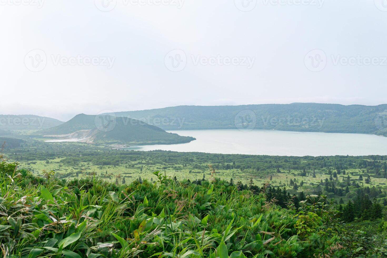 natural landscape of Kunashir island, view of the Golovnin volcano caldera with hot lakes photo