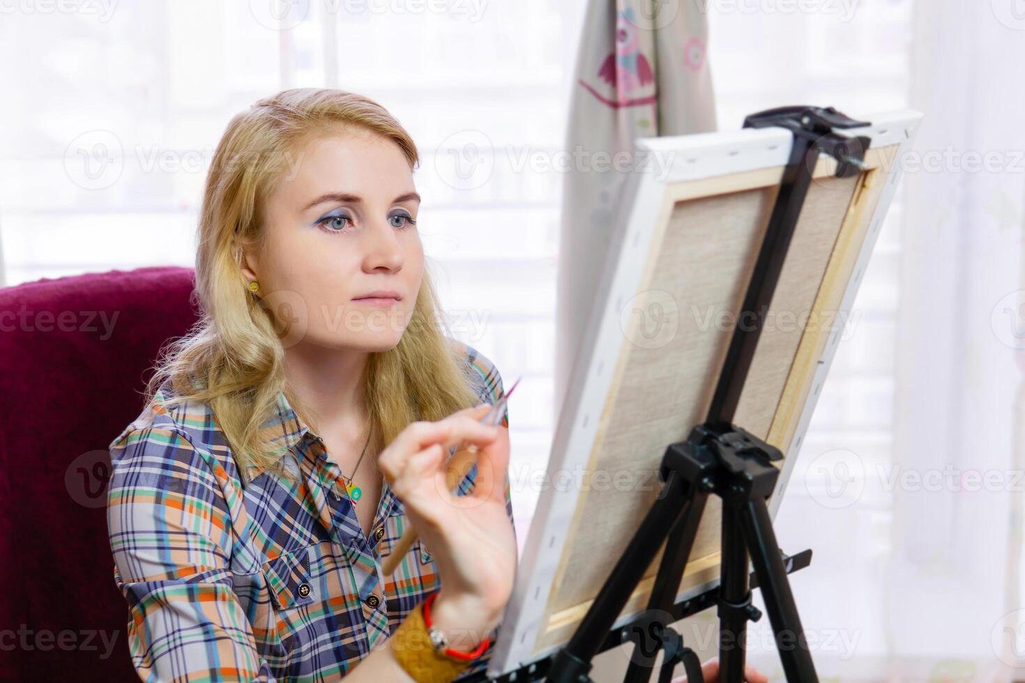 female illustrator makes the finishing touch photo