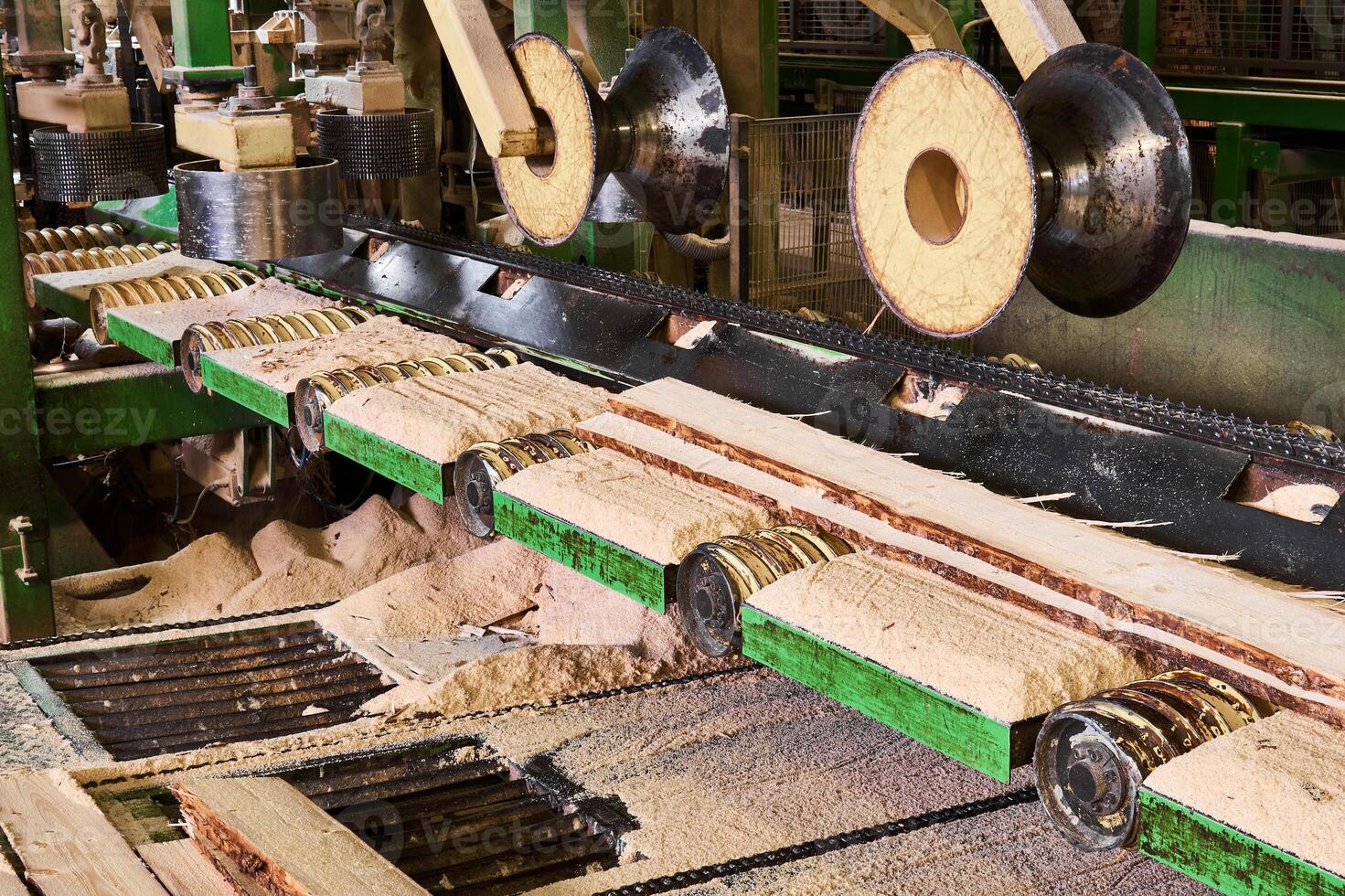fragment of sawmill machinery inside a modern lumber mill photo