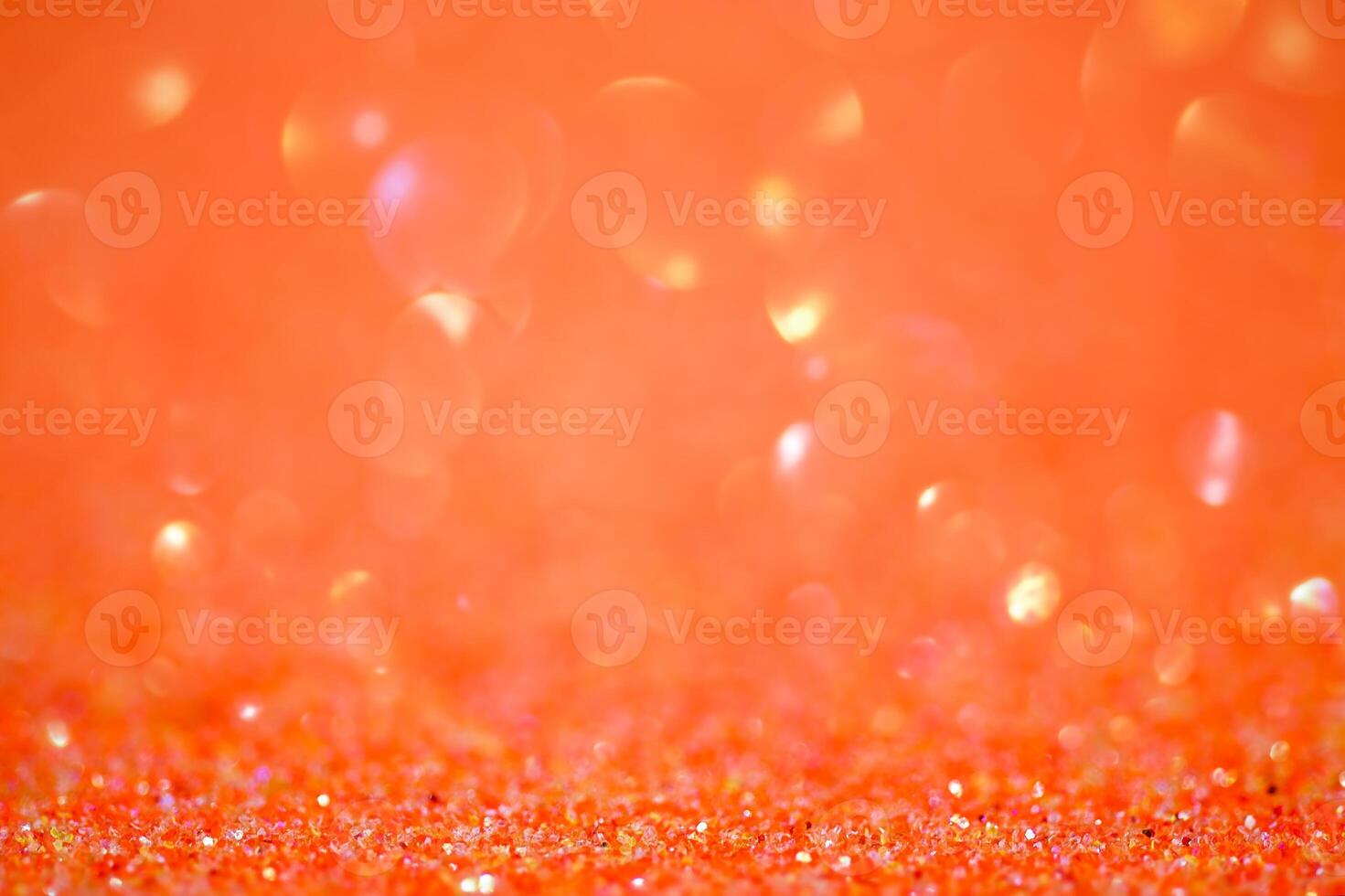 Sparkles defocus light. Glitter paper defocus as background. Orange. photo