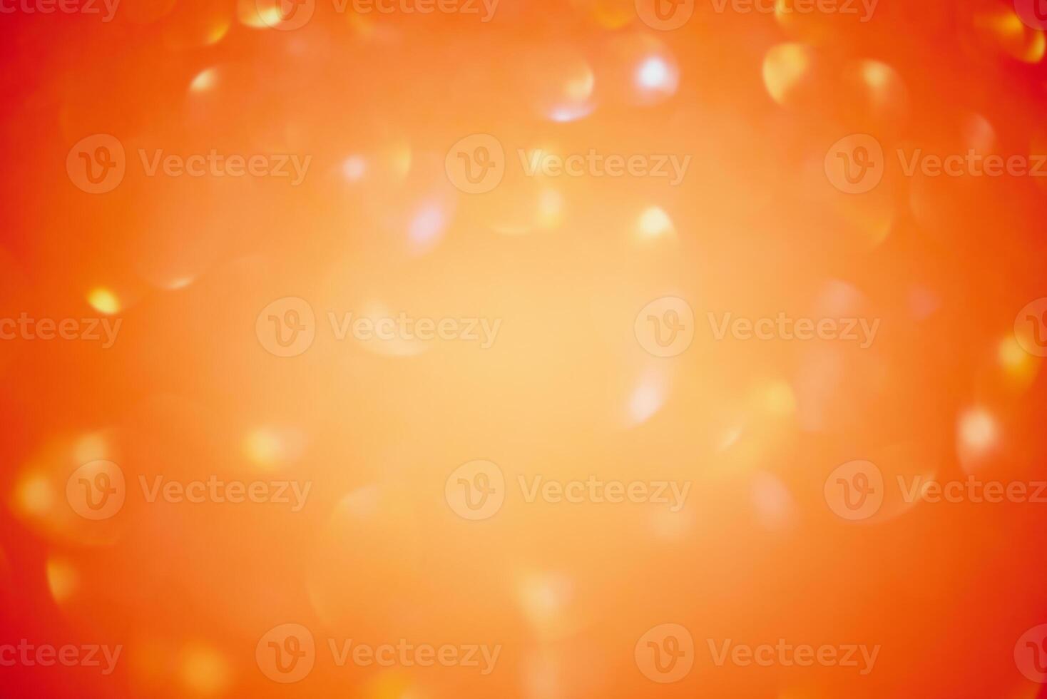 Sparkles defocus light. Orange background and yellow defocus. Glitter paper defocus as background. photo