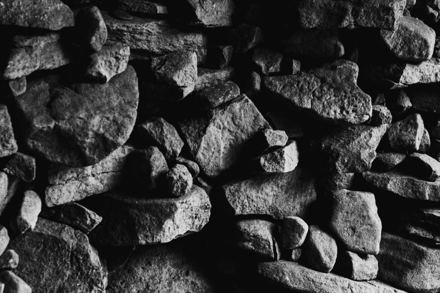 Rock texture in top view serves as a unique and captivating.  Nature from top of hill. Black and white shot. photo