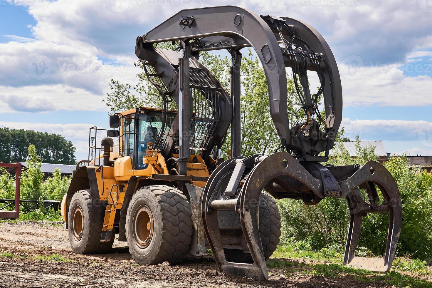 dual function grapple skidder outdoors photo