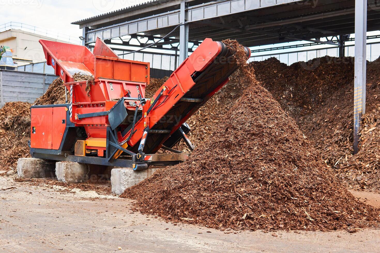 industrial woodchipper producing wood chips photo