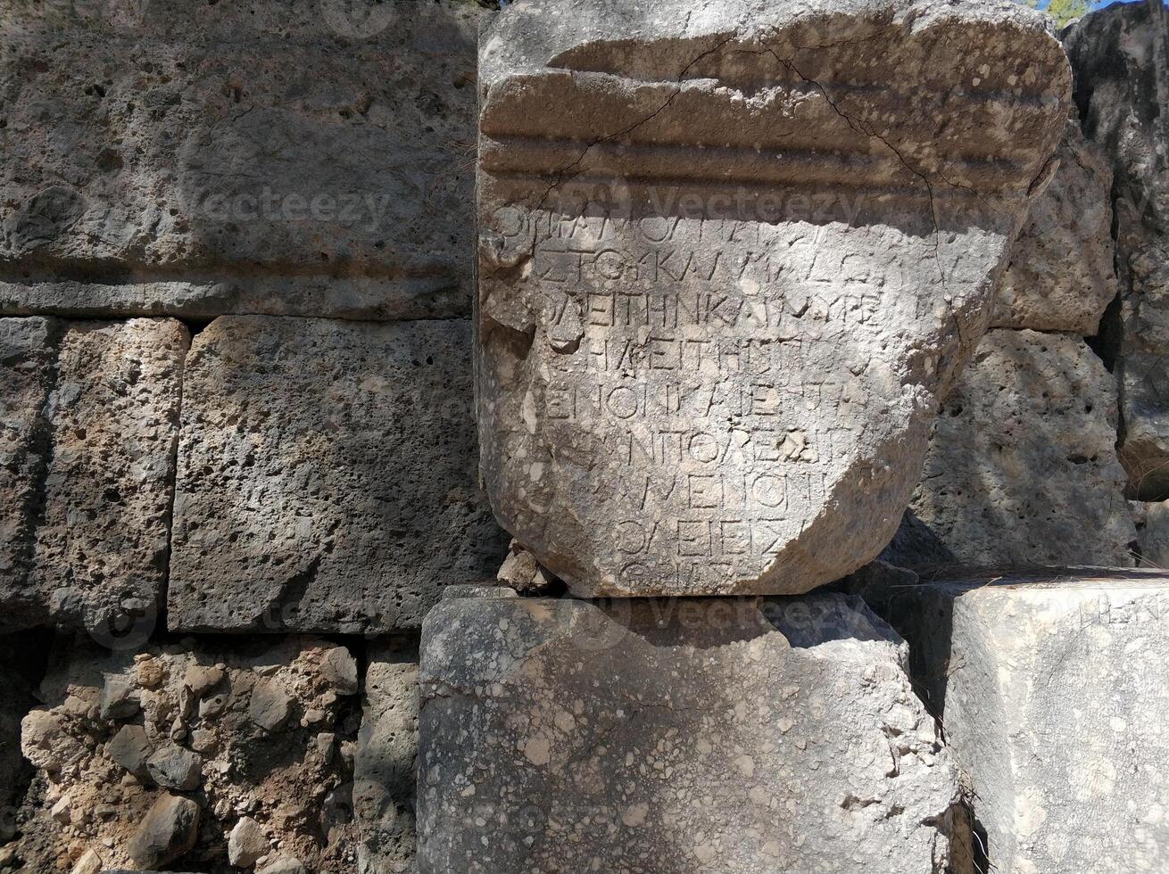 Historical architecture, surviving stones with ancient inscriptions photo