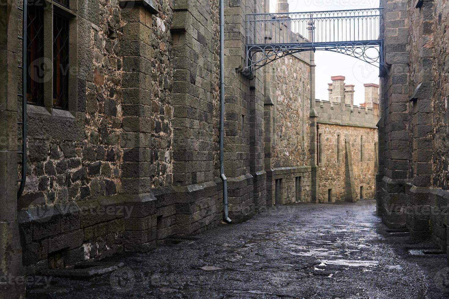 passage between the walls of old palace that looks like a medieval street photo