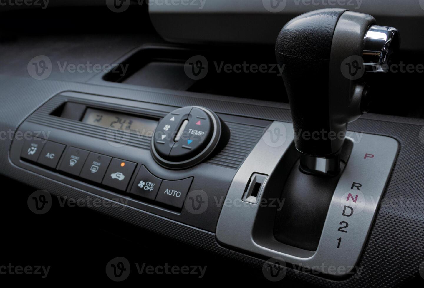 Automatic gear shift and air conditioning panel in a modern car. After some edits. photo