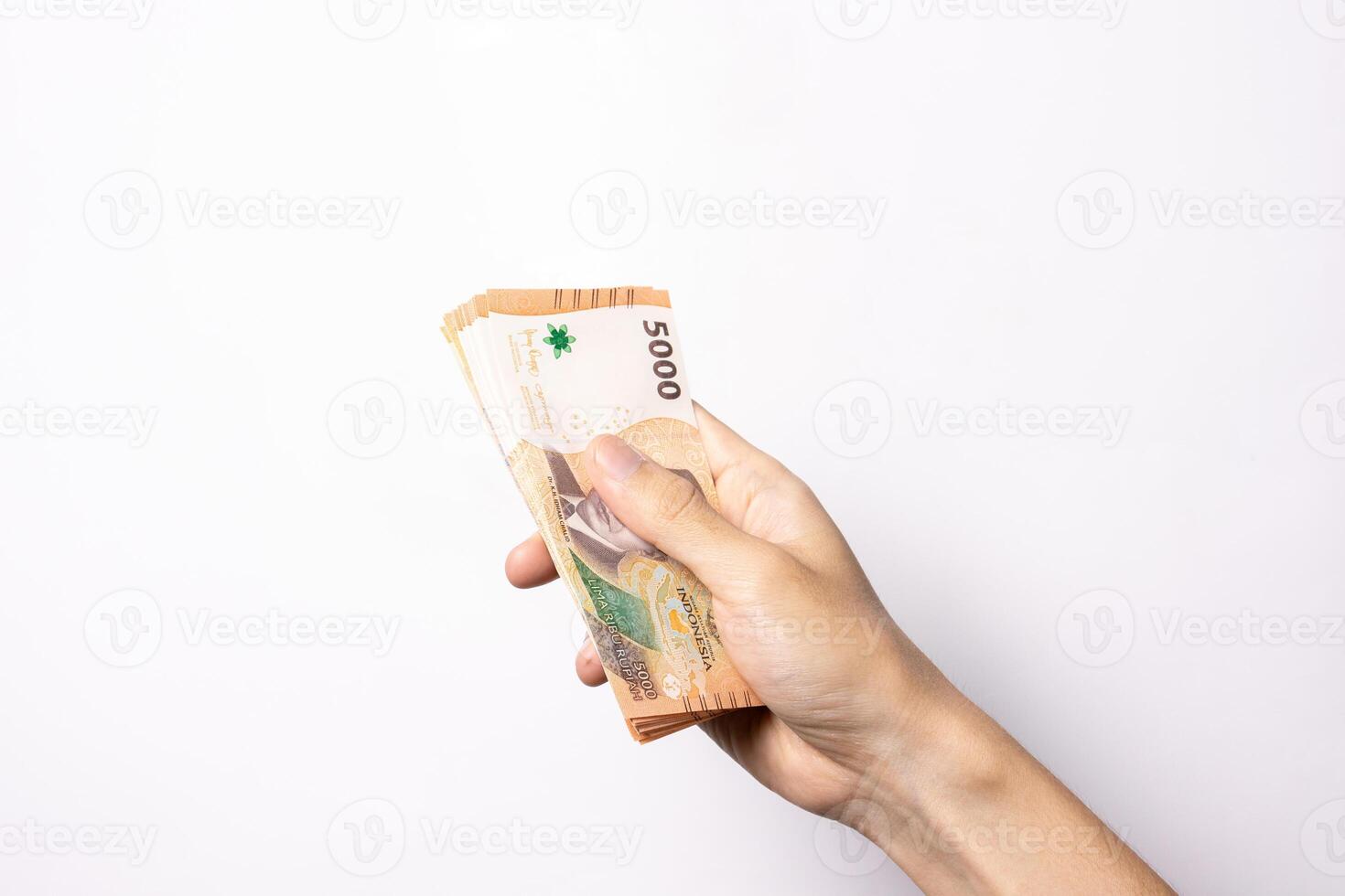 Hand holding amount of money isolated on white background. After some edits. photo