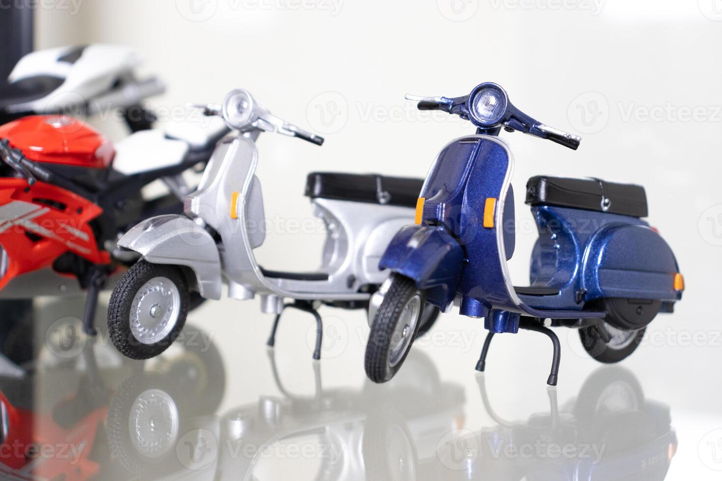 Selective focus. Model of motorbikes placed on glass shelf. After some edits. photo