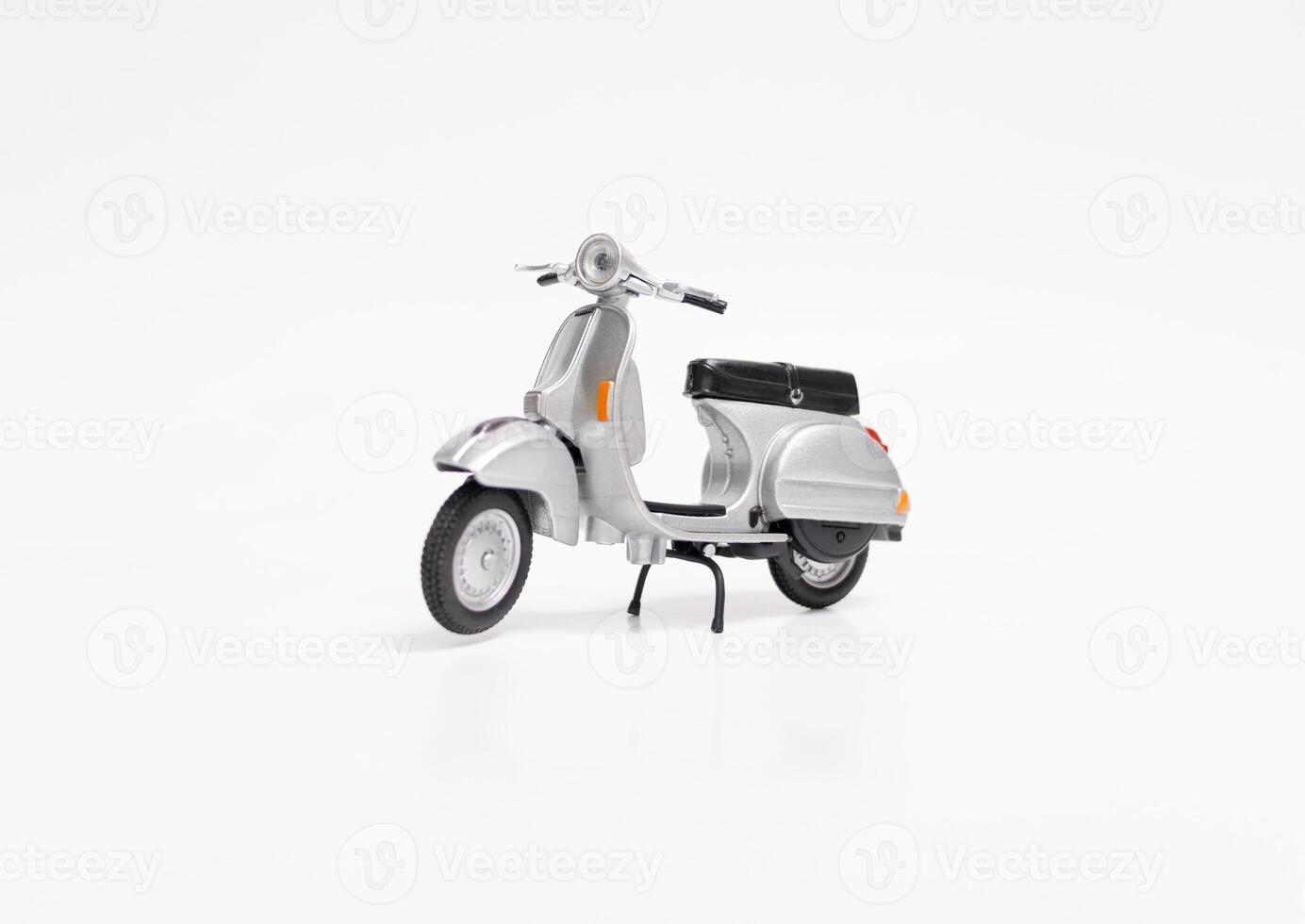 Miniature classic scooter on white background. After some edits. photo