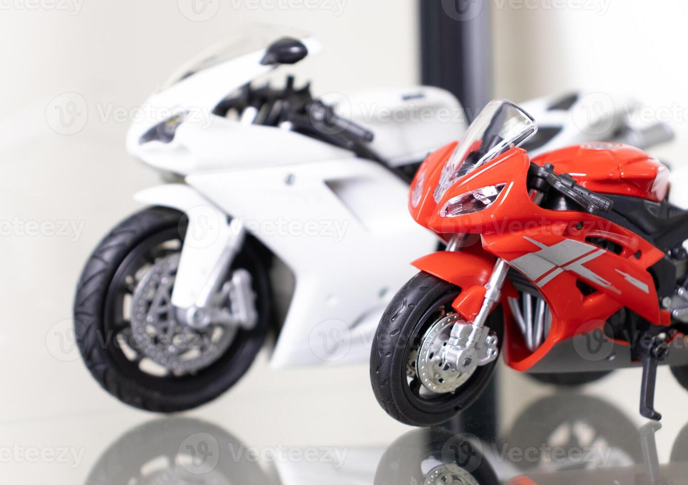 Selective focus. Model of motorbikes placed on glass shelf. After some edits. photo