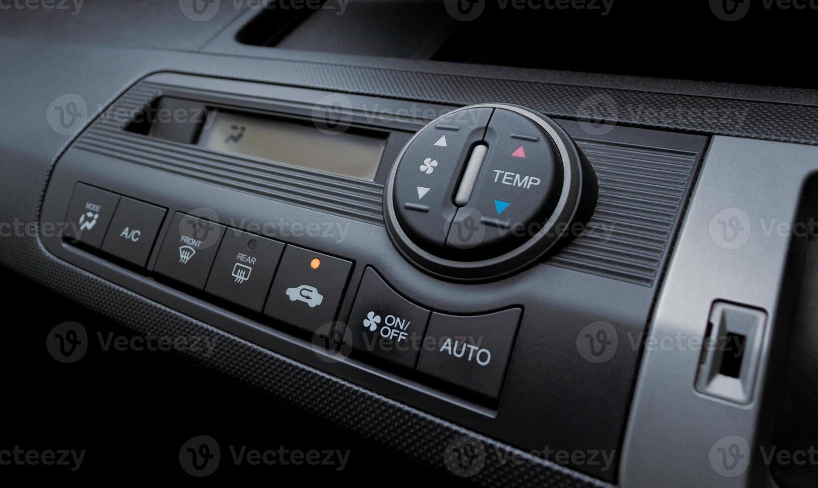 Air conditioner in a modern car, closeup of the buttons. After some edits. photo