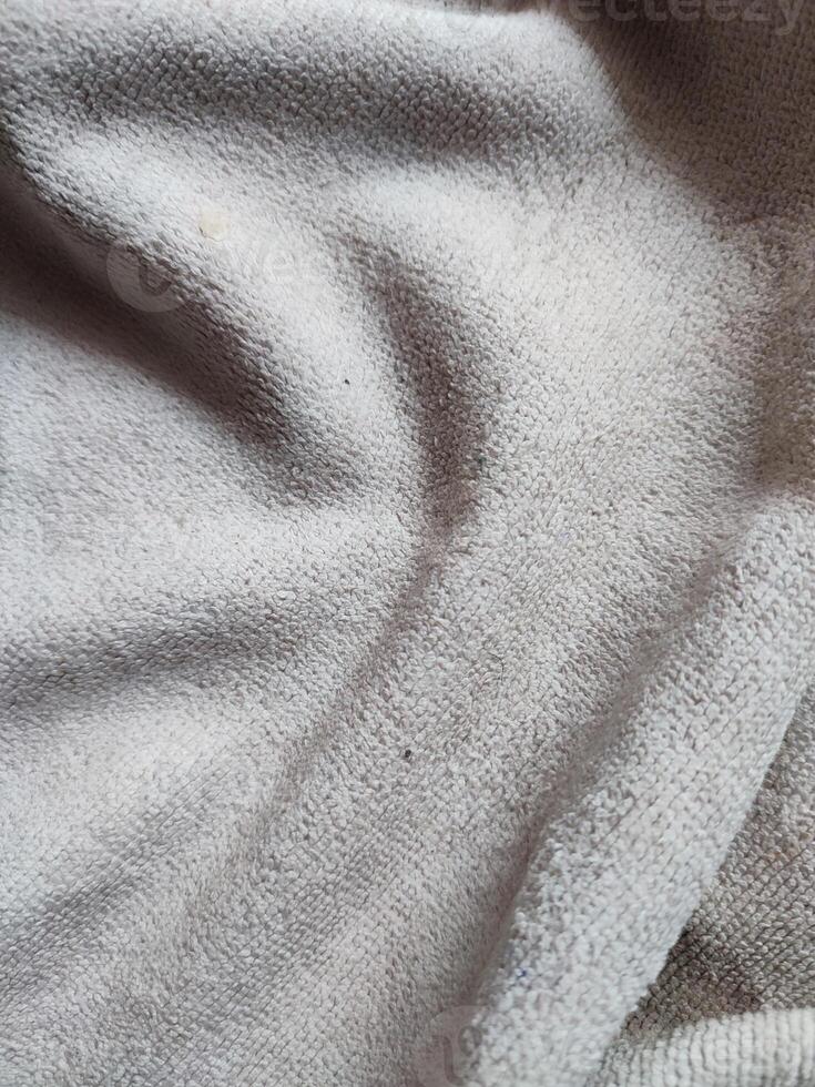 texture, pattern, background of dirty white towel exposed to sunlight photo