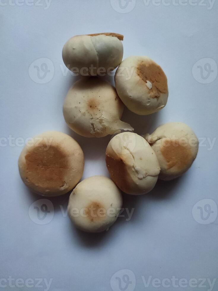 Pile of Bakpia Pathuk isolated on white background. A traditional Chinese-influenced Indonesian snack, filled with green beans. Typical Yogyakarta souvenirs. photo