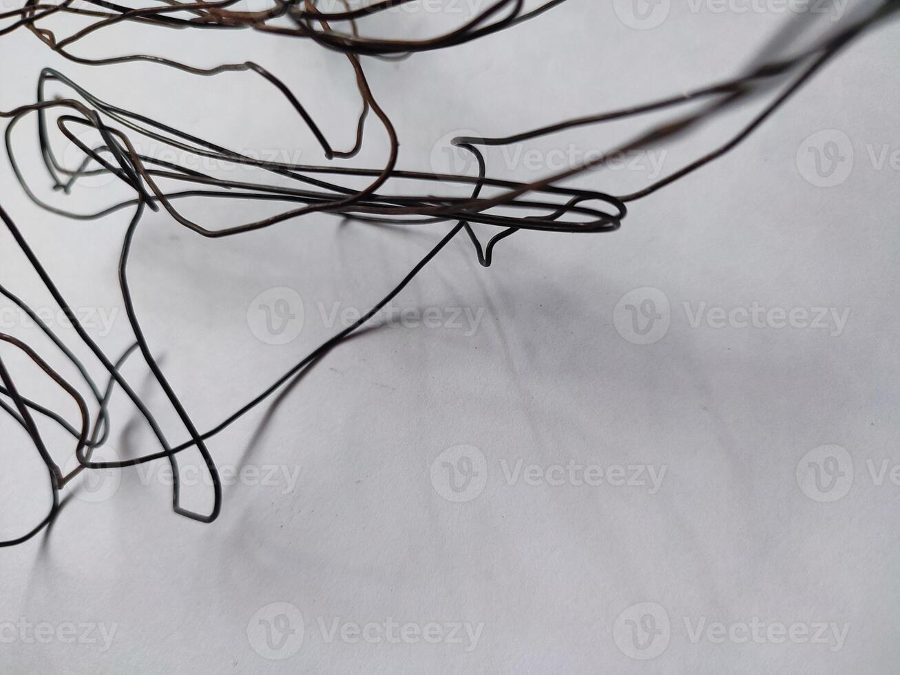 tangled black wire isolated on white photo