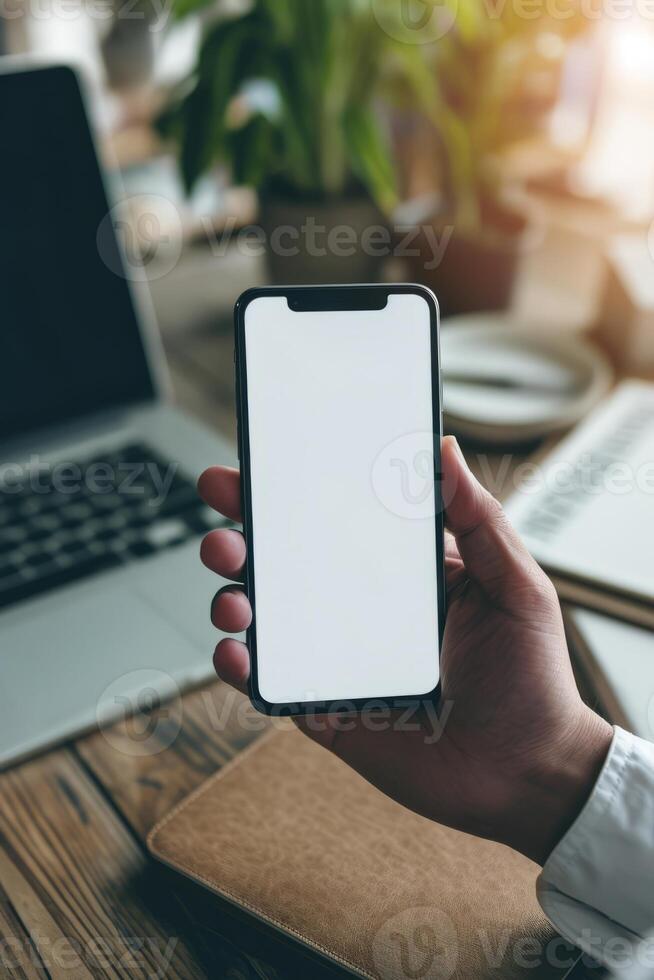 AI generated A man's hand holding a smartphone in modern office with white blank screen, First person view photo