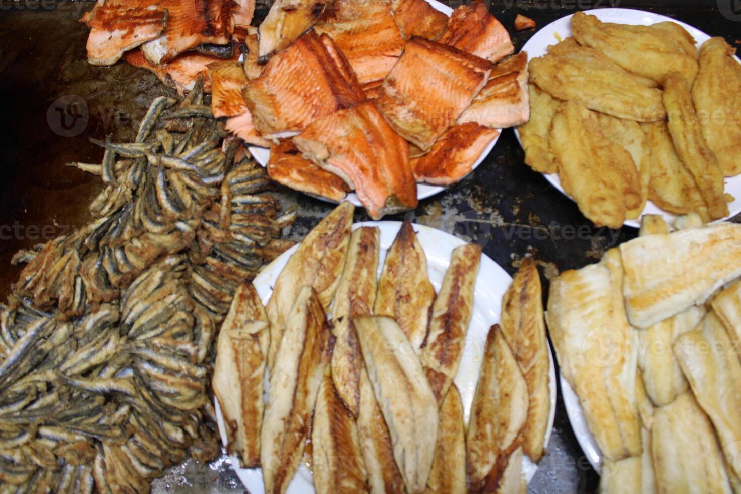fried fish on the counter. fresh and delicious salmon photo