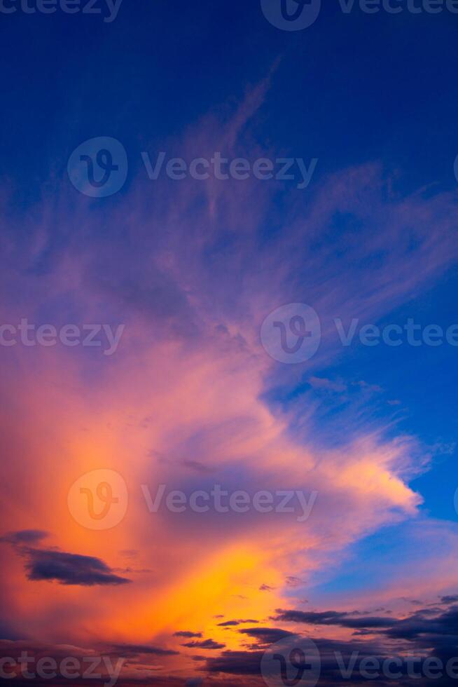 Cumulus clouds and different color tones in the sky at sunset. Dance of colors in the sky. Amazing and incredible sunset. photo