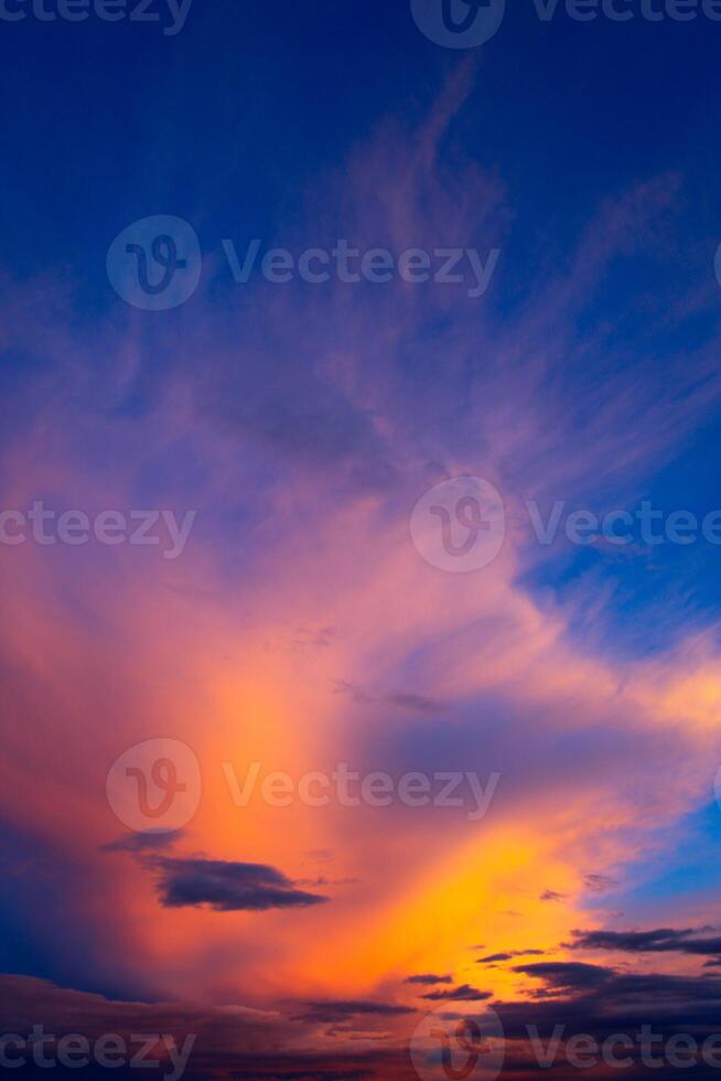 Cumulus clouds and different color tones in the sky at sunset. Dance of colors in the sky. Amazing and incredible sunset. photo