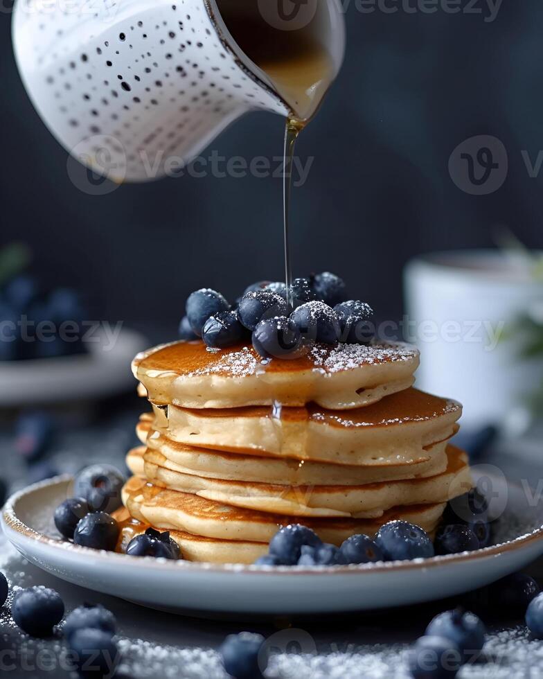 AI generated Gluten free vegan blueberry pancakes, blueberries on top of pancakes and around, The cup is watering the pancakes from above photo