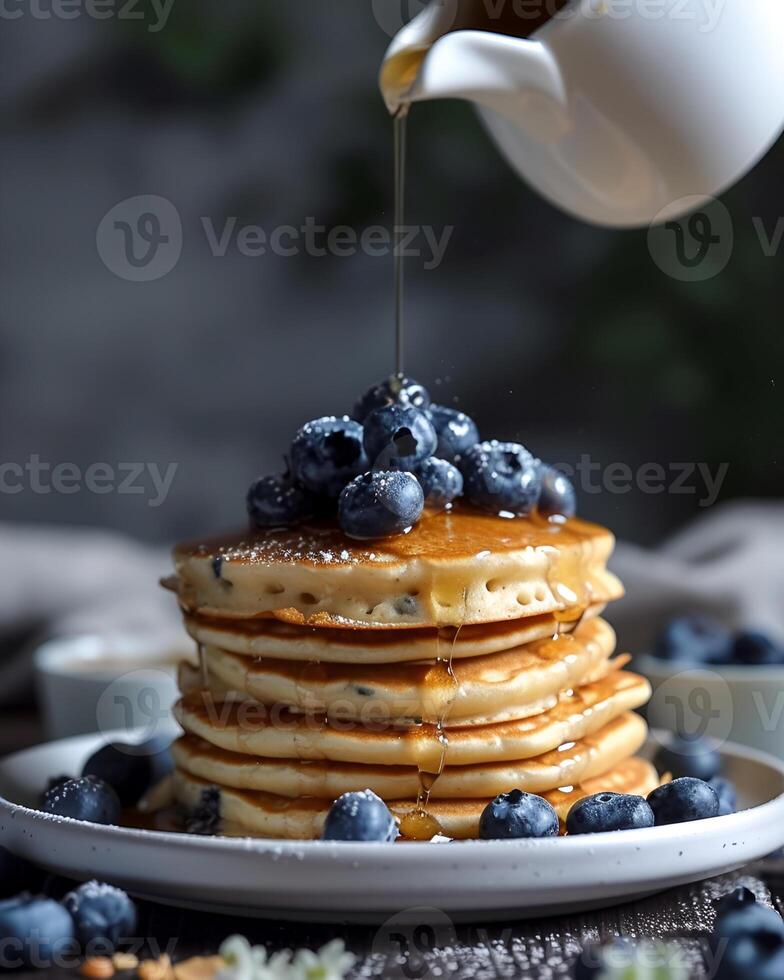 AI generated Gluten free vegan blueberry pancakes, blueberries on top of pancakes and around, The cup is watering the pancakes from above photo