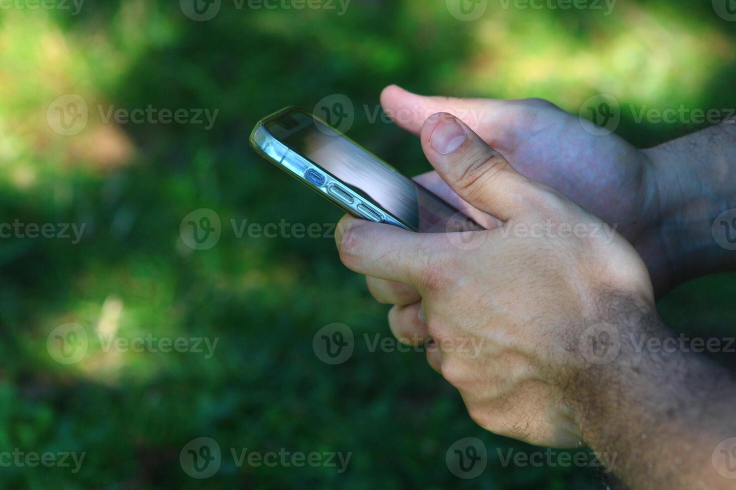 A male hand dealing with a smartphone photo