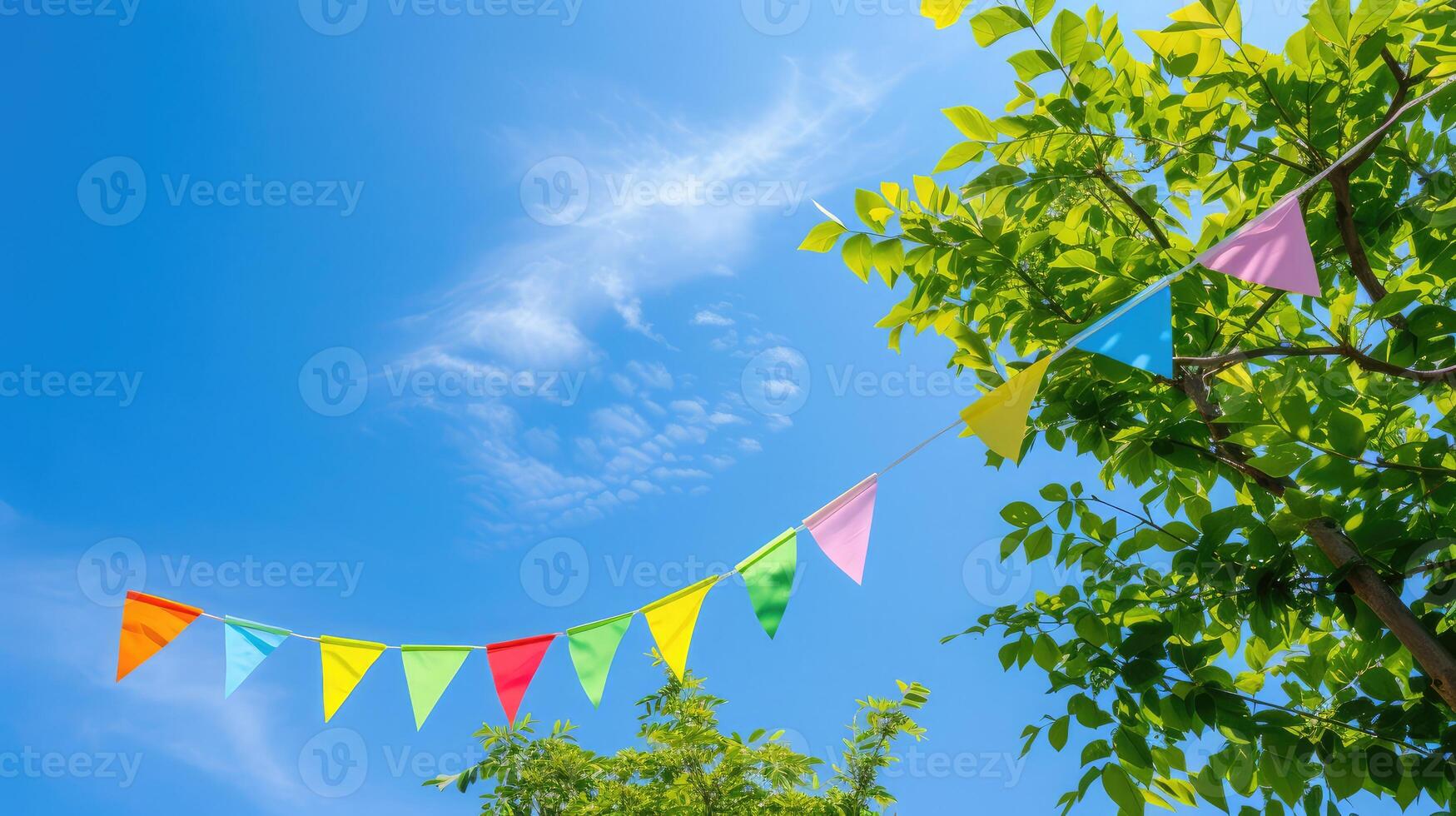 AI generated colorful pennant string decoration in green tree foliage on blue sky, summer party background template banner with copy space photo