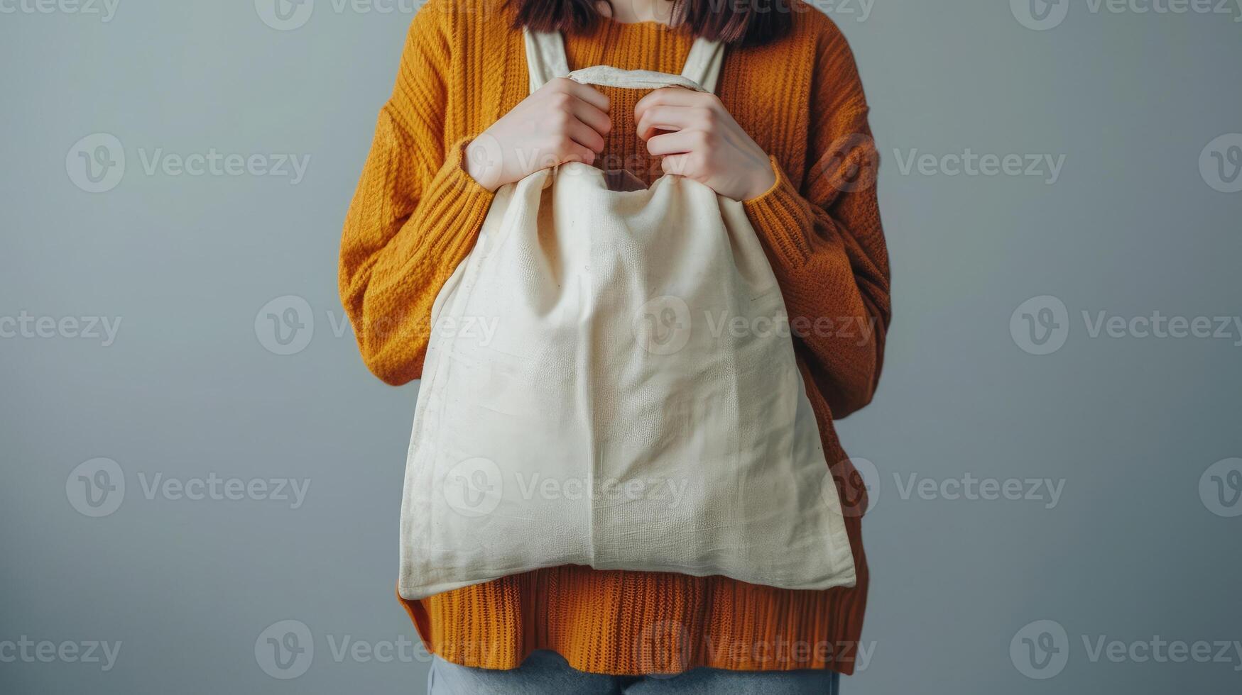 AI generated Girl holding white cotton tote bag on a white wall background photo
